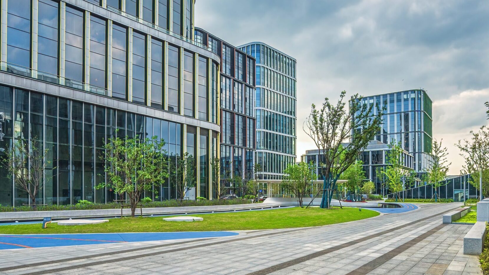 A modern exterior of an office building with landscaping